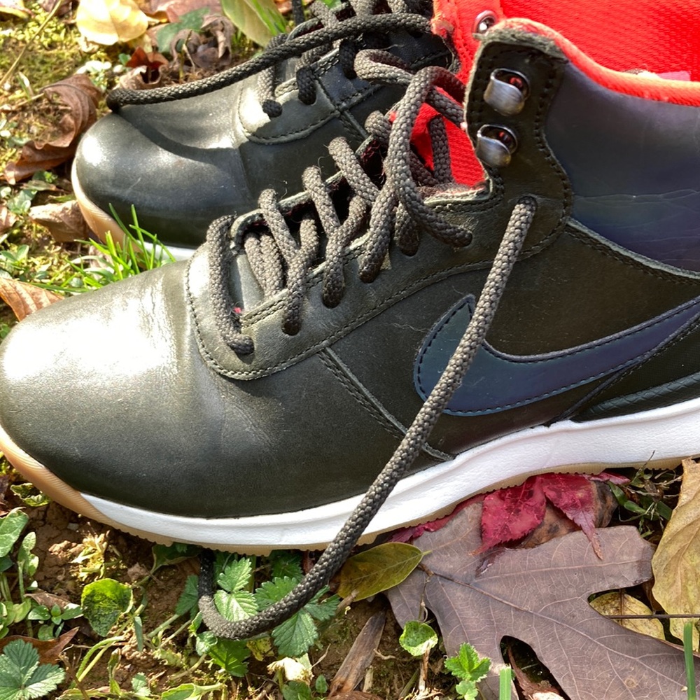 Nike black sneakers with hologram swoosh and upper hi top